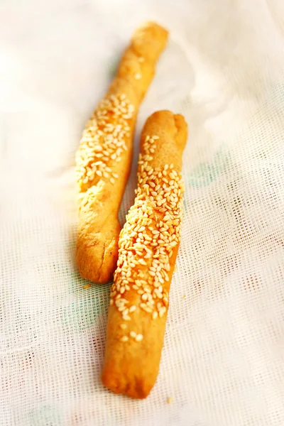 Crispy sticks with sesame on napkin — Stock Photo, Image