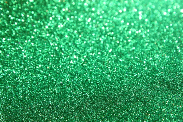 Abstracte groene glitter lichten of Kerstmis achtergrond — Stockfoto