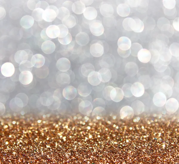 Ouro e prata desfocado brilho luzes de fundo. resumo bokeh . — Fotografia de Stock