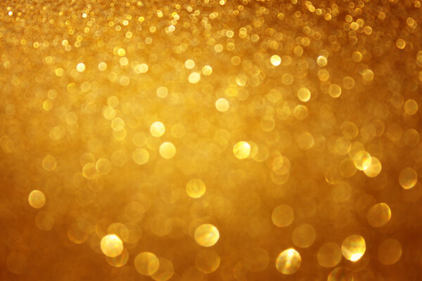 Golden christmas background or gold defoucsed lights background