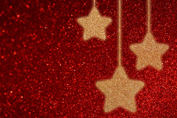 Red defocused background with bokeh lights and twinkling stars — Stock Photo, Image