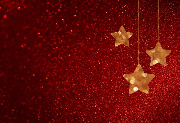 Fondo rojo desenfocado con luces bokeh y estrellas centelleantes —  Fotos de Stock