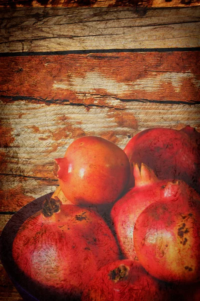 Pomegrantes griunge háttér - vintage stílusú fotó — Stock Fotó