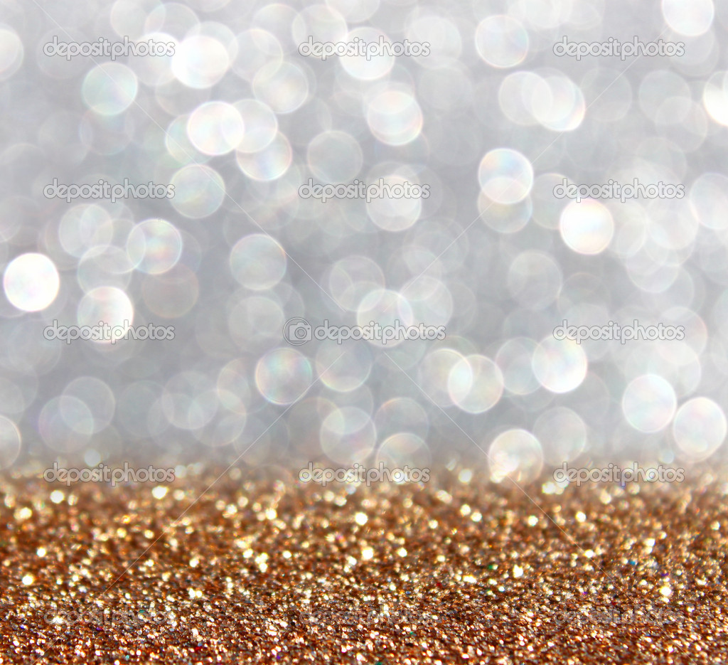 Gold and silver defocused glitter lights background. abstract bokeh.