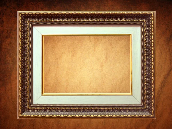 Golden frame over grunge wallpaper — Stock Photo, Image
