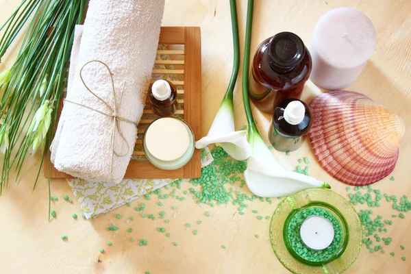 Spa and wellness setting with natural soap, candles and towel — Stock Photo, Image