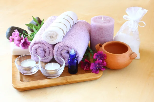 Spa and wellness setting with natural soap, candles and towel — Stock Photo, Image