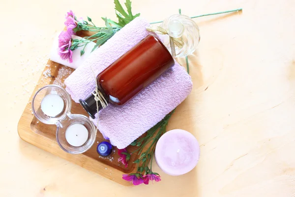 Spa and wellness setting with natural soap, candles and towel — Stock Photo, Image