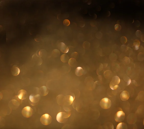 Golden background of defocused abstract lights. — Stock Photo, Image