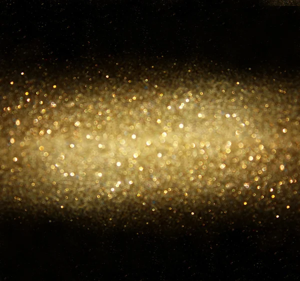 Золотой фон разряженных абстрактных огней — стоковое фото