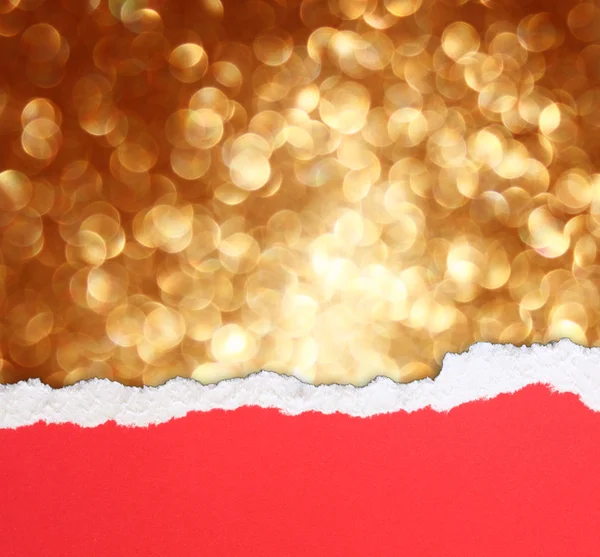 Golden bokeh lights and red torn paper — Stock Photo, Image