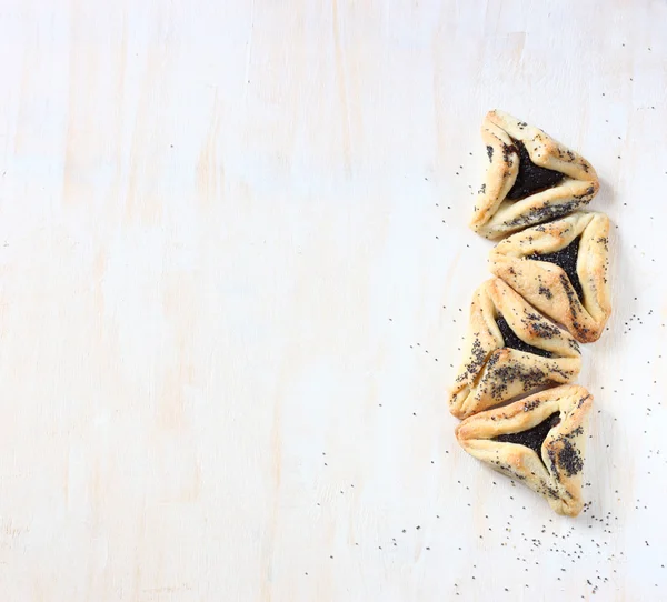 Hamantaschen cookies of hamans oren voor purim vakantie feest. bovenaanzicht. — Stockfoto