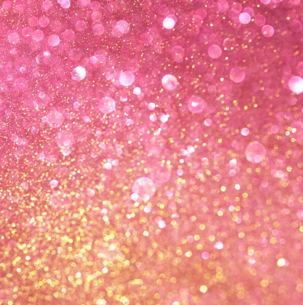 Gold and pink abstract bokeh lights. defocused background