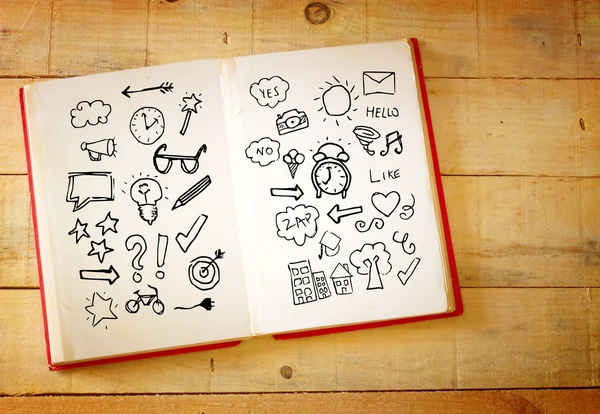 Open book with doodles — Stock Photo, Image