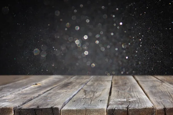 Board and dark bokeh — Stock Photo, Image