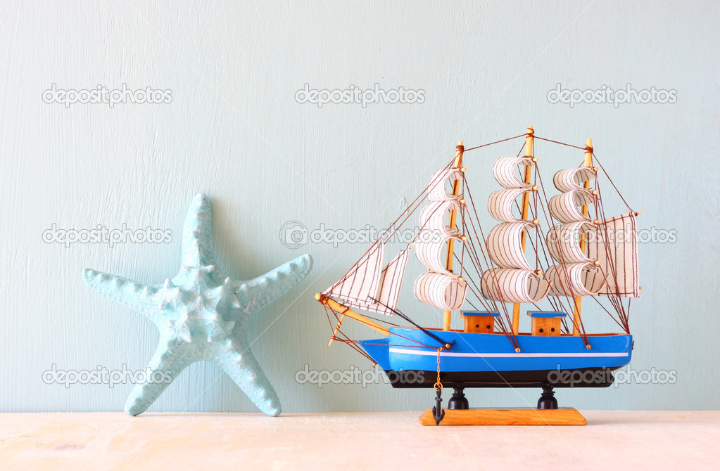Wooden ship toy model and starfish
