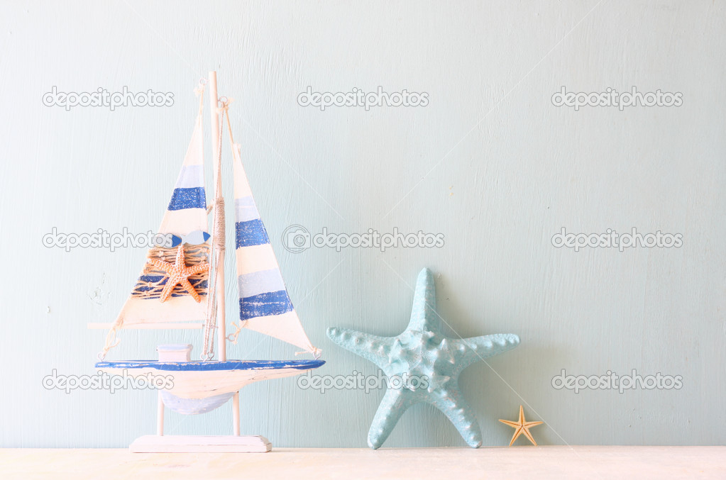 Wooden ship toy model and starfishes
