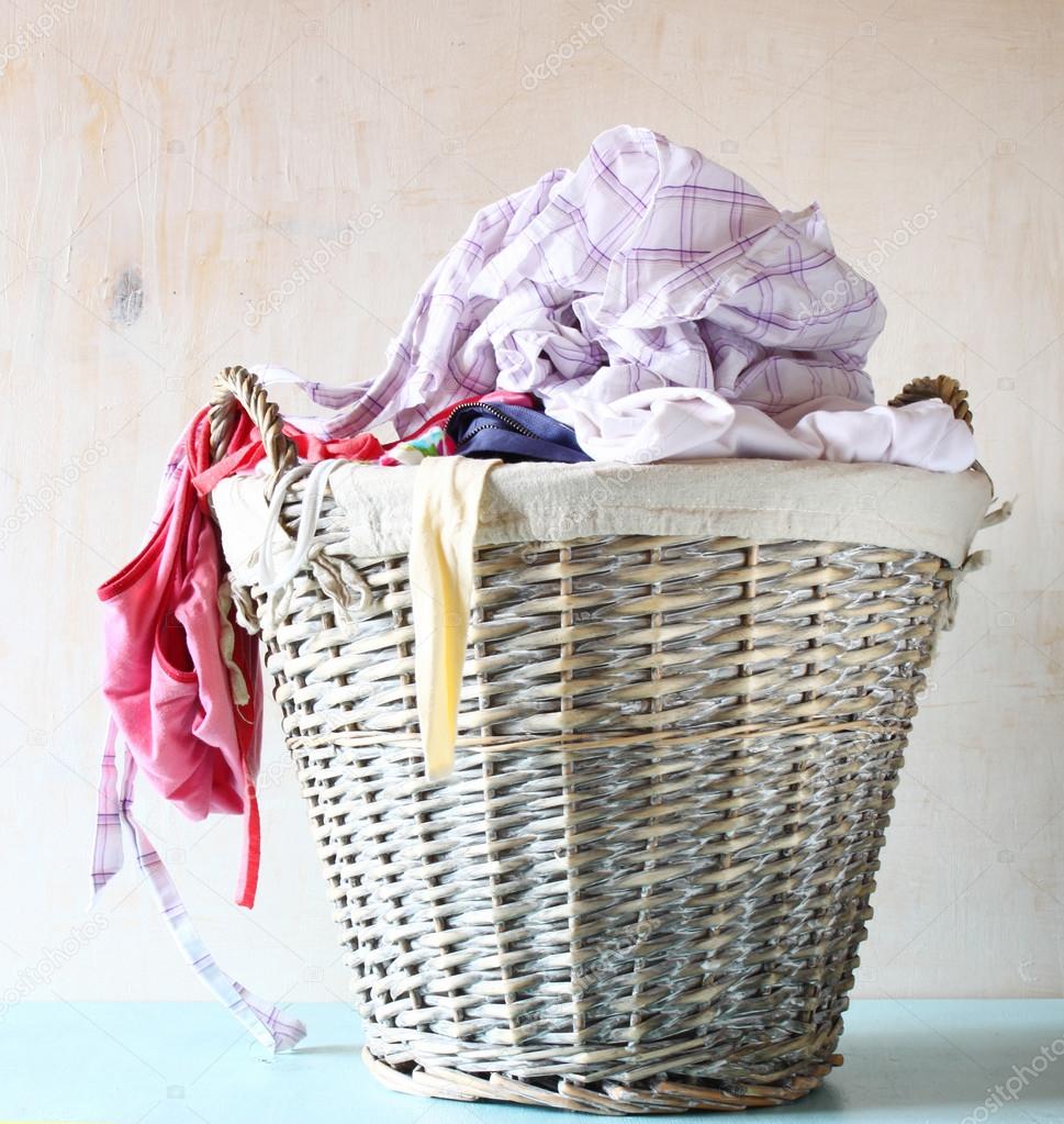 Laundry basket full with clothes — Stock Photo © tomert 48766209