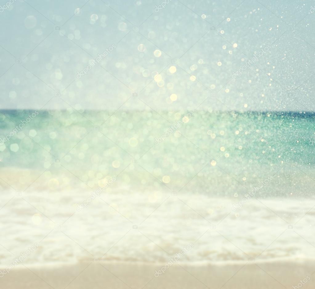 Background of blurred beach and sea waves with bokeh lights, vintage filter.