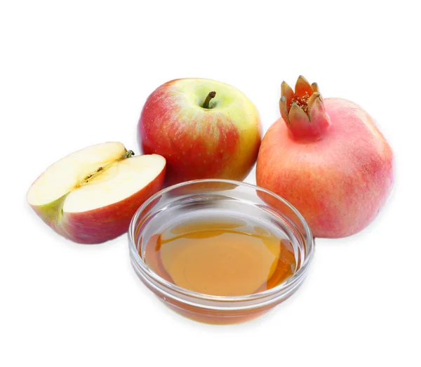 犹太新年概念 — — 苹果蜂蜜和孤立的石榴。传统节日符号. — 图库照片