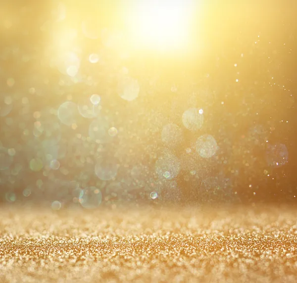 Glitter vintage lights background. light gold and black. defocused. — Stock Photo, Image