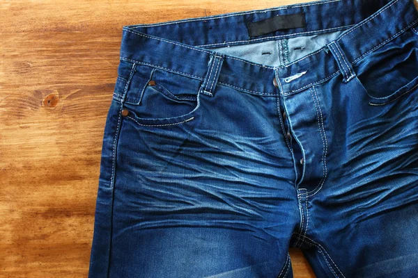 Close up van versleten blue jeans — Stockfoto