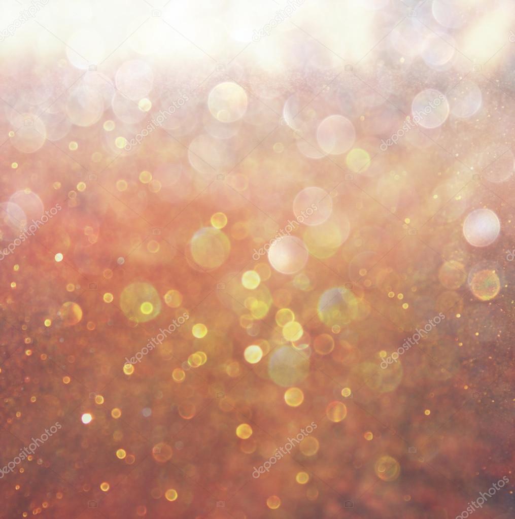 Abstract photo of light burst among trees and glitter bokeh lights. filtered image and textured. image is blurred.