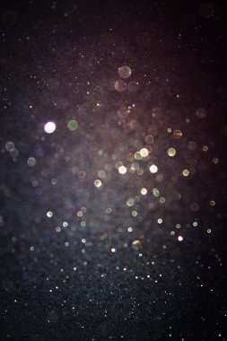 Glitter vintage lights background. light gold and black. defocused. clipart