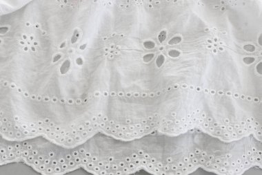 Beyaz işlemeli dantel kumaşın arka planı