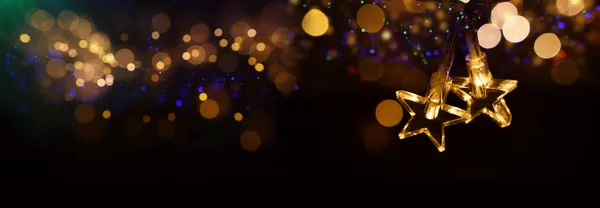 Christmas Warm Gold Garland Lights Dark Background Glitter Overlay Stock Image