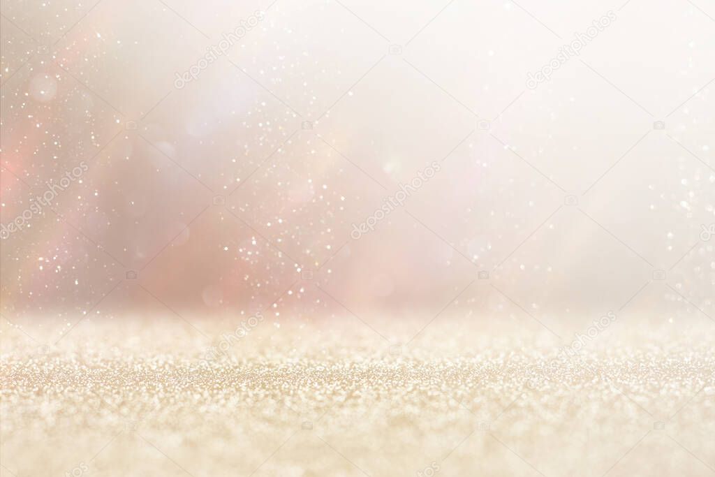 background of abstract gold and silver glitter lights. defocused