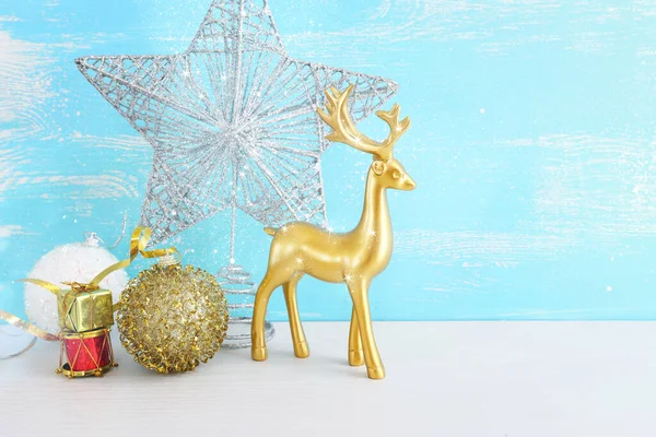 Image Christmas Decorations Gold Deer Front Pastel Blue Background — Stock Photo, Image