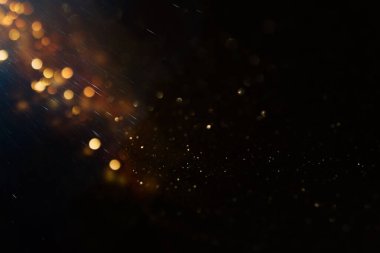 soyut glitter ışıkları arka plan. altın ve siyah. de odaklı