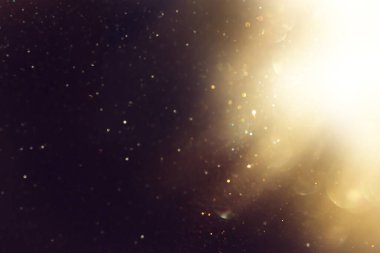 soyut glitter ışıkları arka plan. altın ve siyah. de odaklı