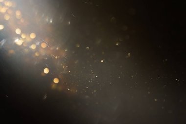 soyut glitter ışıkları arka plan. altın ve siyah. de odaklı