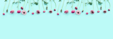 Top view image of pink flowers composition over blue background