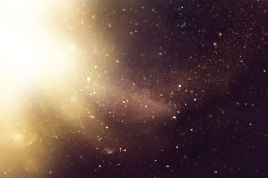 soyut glitter ışıkları arka plan. altın ve siyah. de odaklı