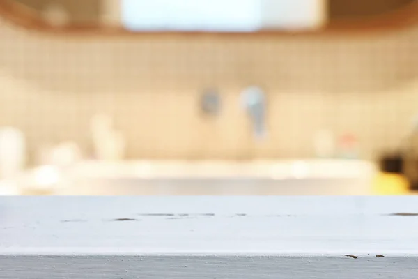 empty table board and defocused indoor bathroom background. product display concept