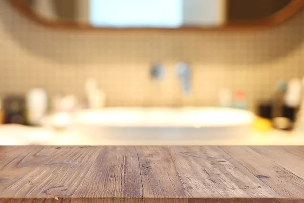 empty table board and defocused indoor bathroom background. product display concept