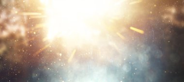 Soyut ışıltılı ışıkların arkaplanı patladı. Altın ve mavi. & Odaklan