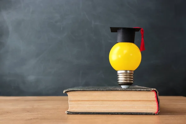 Education concept image. Creative idea and innovation. light bulb metaphor over blackboard background