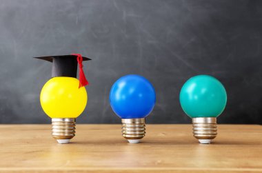 Education concept image. Creative idea and innovation. light bulb metaphor over blackboard background