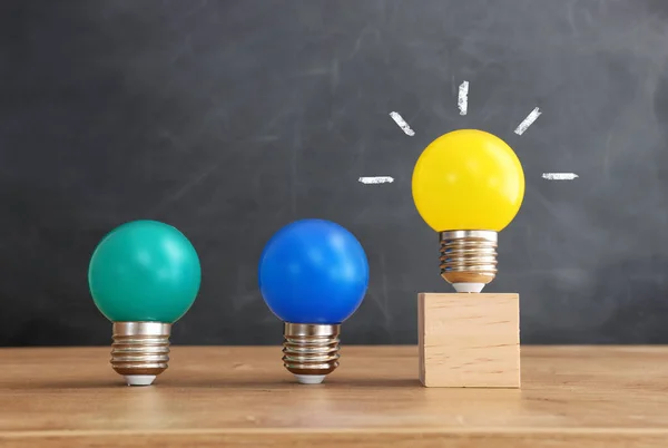 Education concept image. Creative idea and innovation. light bulb metaphor over blackboard background