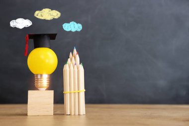 Education concept image. Creative idea and innovation. light bulb metaphor over blackboard background