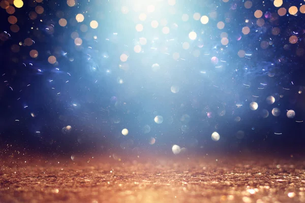 Background Abstract Glitter Lights Gold Blue Black Focused — Stock Photo, Image