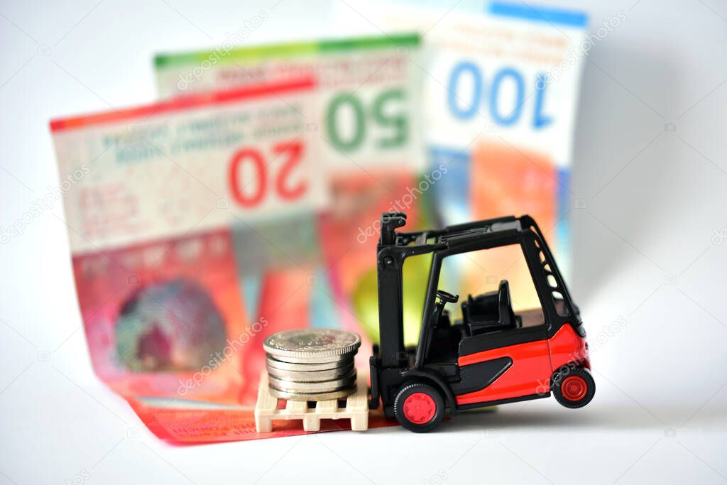 toy forklift with swiss money