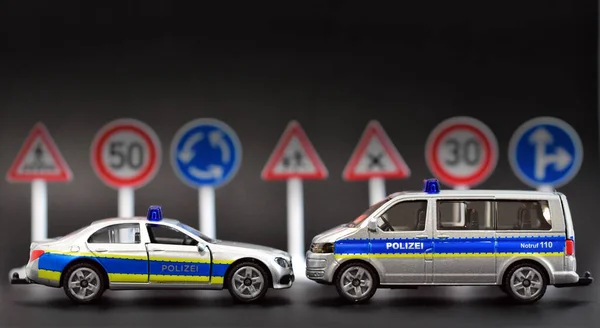 german police toy cars with road signs