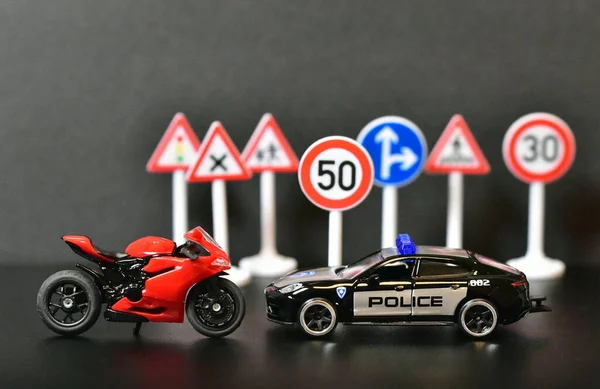 usa police toy car with motorcycle and road signs