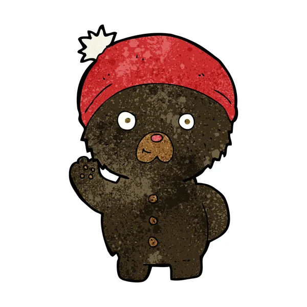 Dessin animé agitant ours en peluche noir en chapeau d'hiver — Image vectorielle