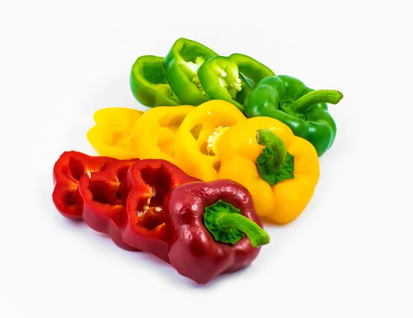 Colorful sweet peppers sliced in pieces isolated on white background — Stock Photo, Image